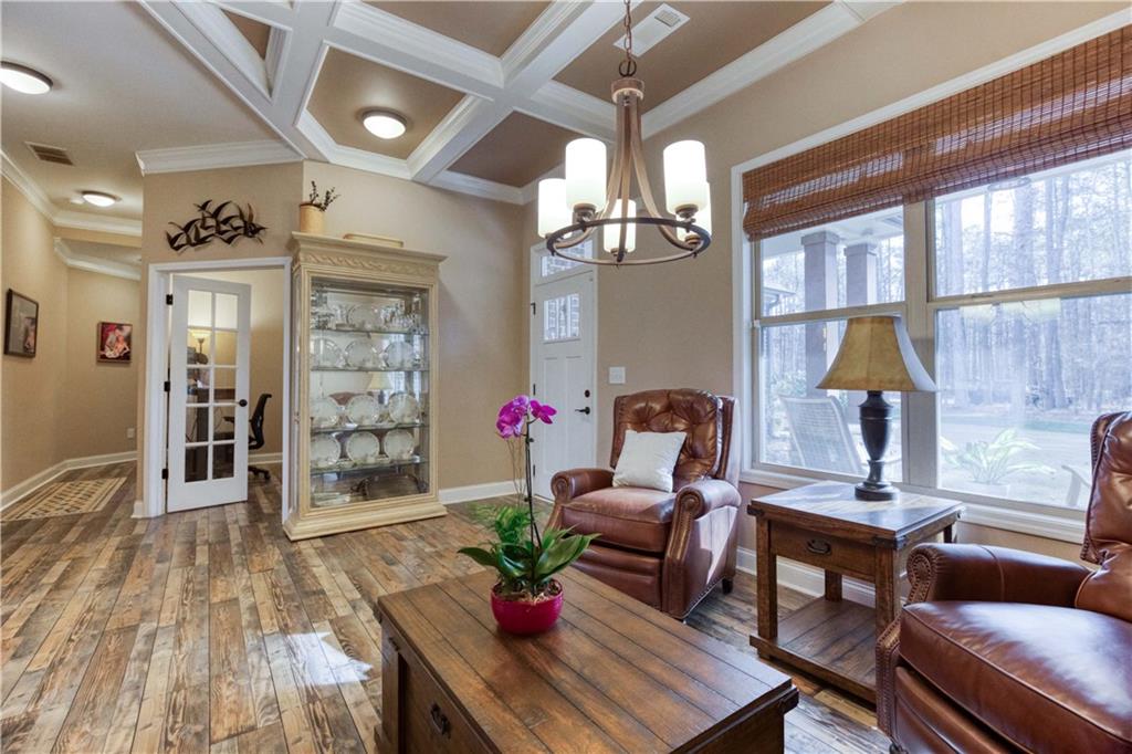 390 Herring Road Grayson, GA 30017 - Photo 12 of 59 a living room with furniture and wooden floor