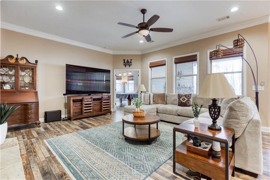 390 Herring Road Grayson, GA 30017 - Photo 13 of 59 a living room with furniture and a flat screen tv