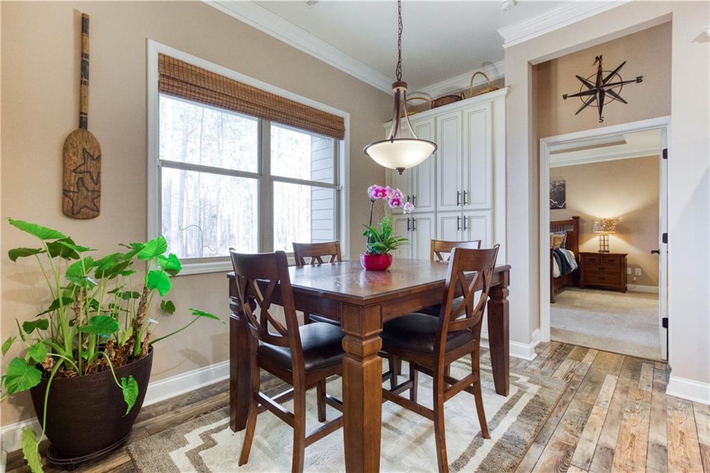 390 Herring Road Grayson, GA 30017 - Photo 23 of 59 a view of a dining room with furniture window and wooden floor