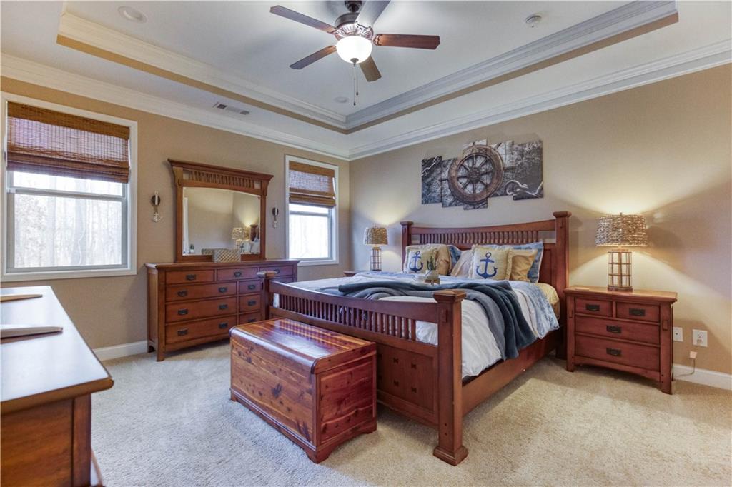 390 Herring Road Grayson, GA 30017 - Photo 24 of 59 a bed room with a bed and a dresser