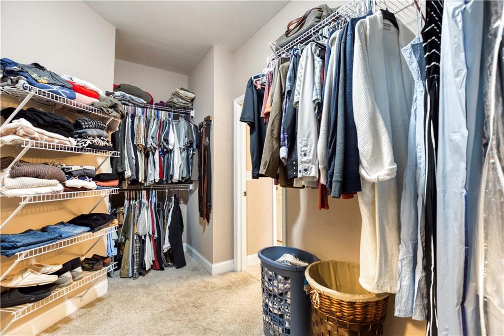 390 Herring Road Grayson, GA 30017 - Photo 29 of 59 a view of walk in closet with clothes and shoes