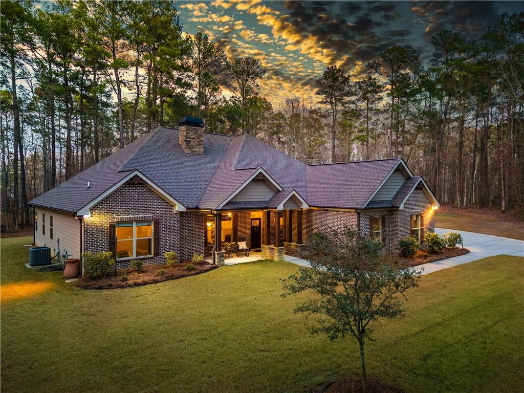 390 Herring Road Grayson, GA 30017 - Photo 3 of 59 a front view of a house with a yard