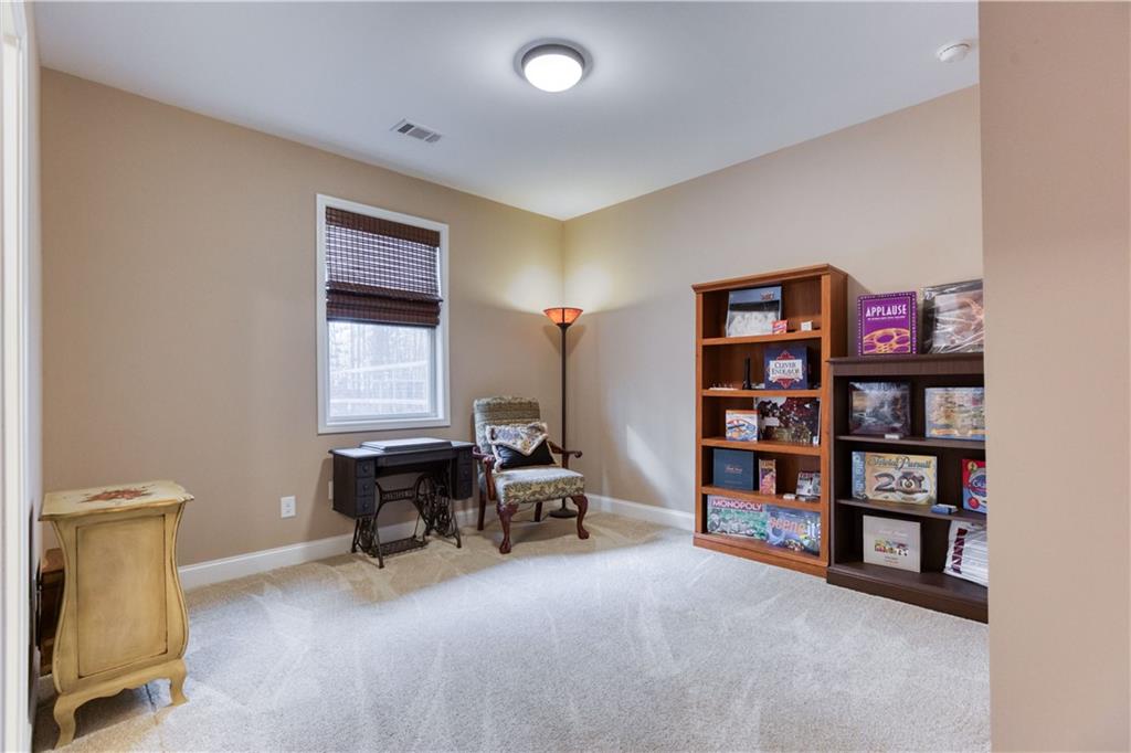 390 Herring Road Grayson, GA 30017 - Photo 44 of 59 a view of a livingroom with workspace and a window