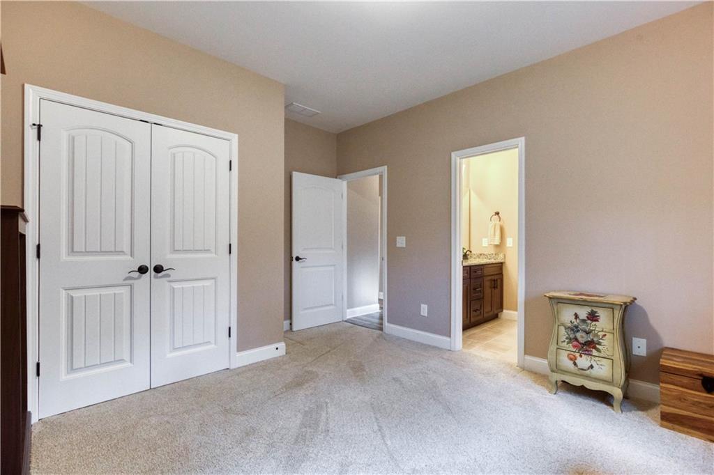 390 Herring Road Grayson, GA 30017 - Photo 45 of 59 a view of a livingroom with an empty space and a empty room