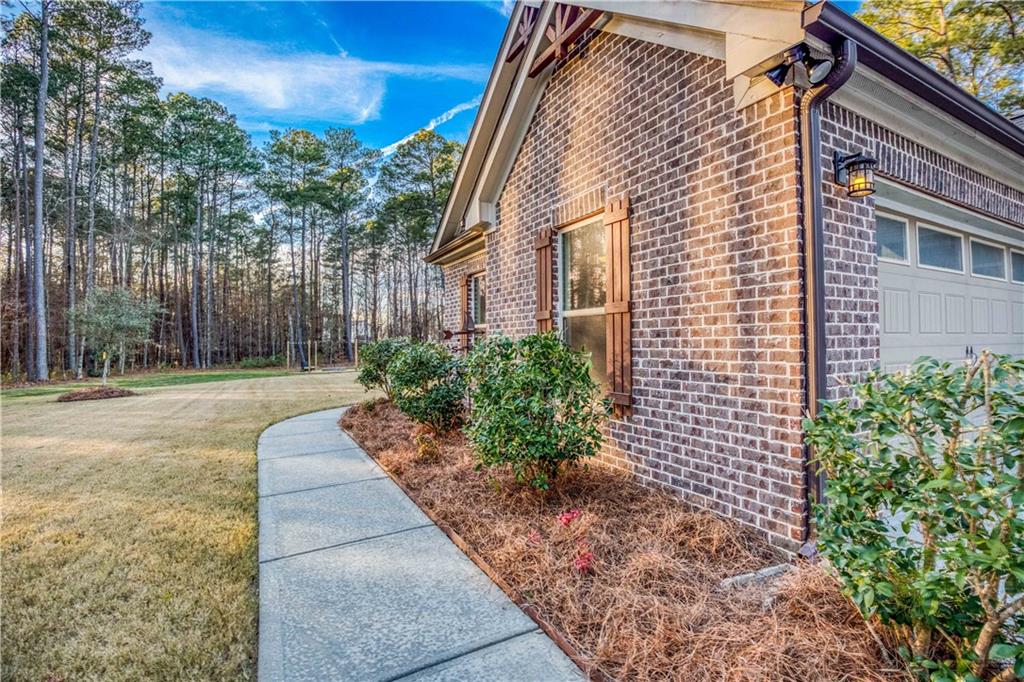390 Herring Road Grayson, GA 30017 - Photo 5 of 59 a view of a pathway with a house