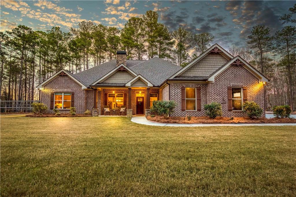 390 Herring Road Grayson, GA 30017 - Photo 58 of 59 a front view of a house with a yard and trees