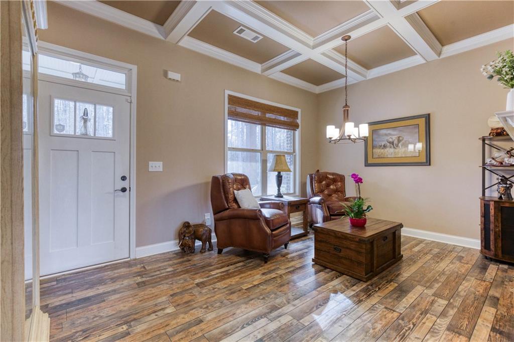 390 Herring Road Grayson, GA 30017 - Photo 9 of 59 a living room with furniture and a wooden floor