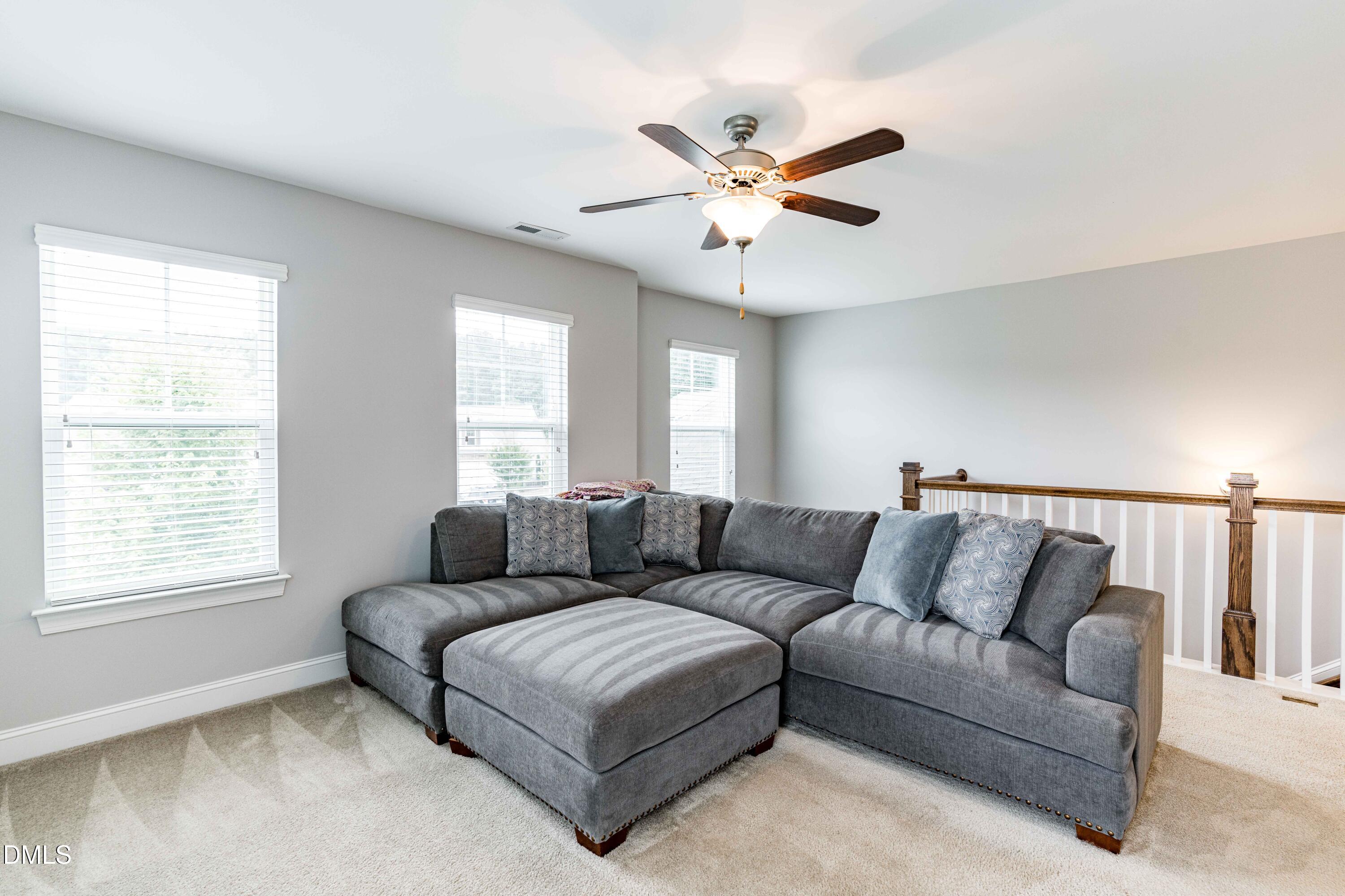 5405 Weathered Rock Court Knightdale, NC 27545 - Photo 18 of 36 a living room with furniture and a window
