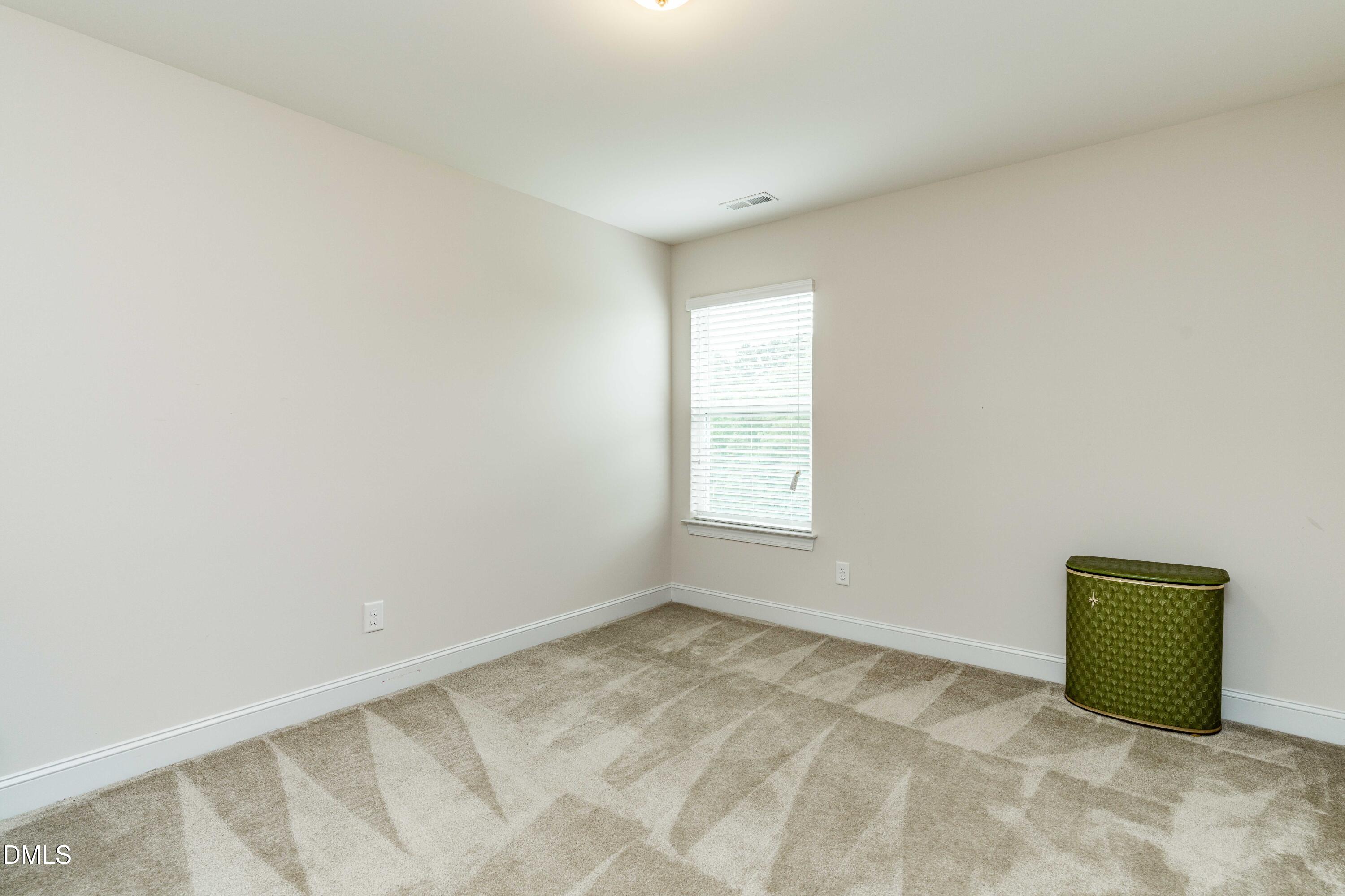 5405 Weathered Rock Court Knightdale, NC 27545 - Photo 22 of 36 a view of an empty room and window