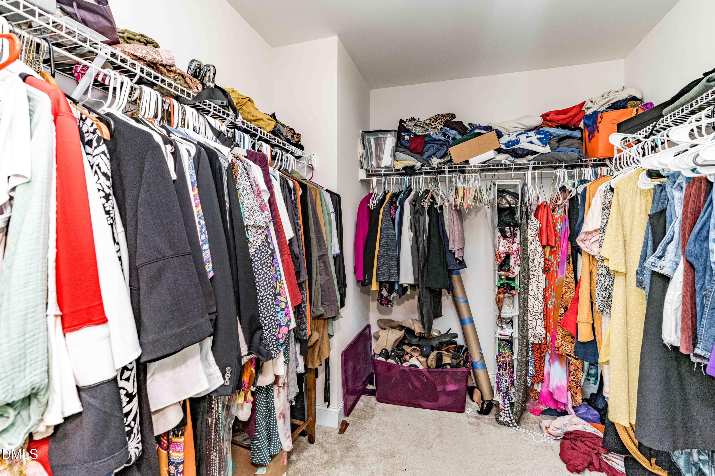 5405 Weathered Rock Court Knightdale, NC 27545 - Photo 27 of 36 a view of walk in closet with clothes