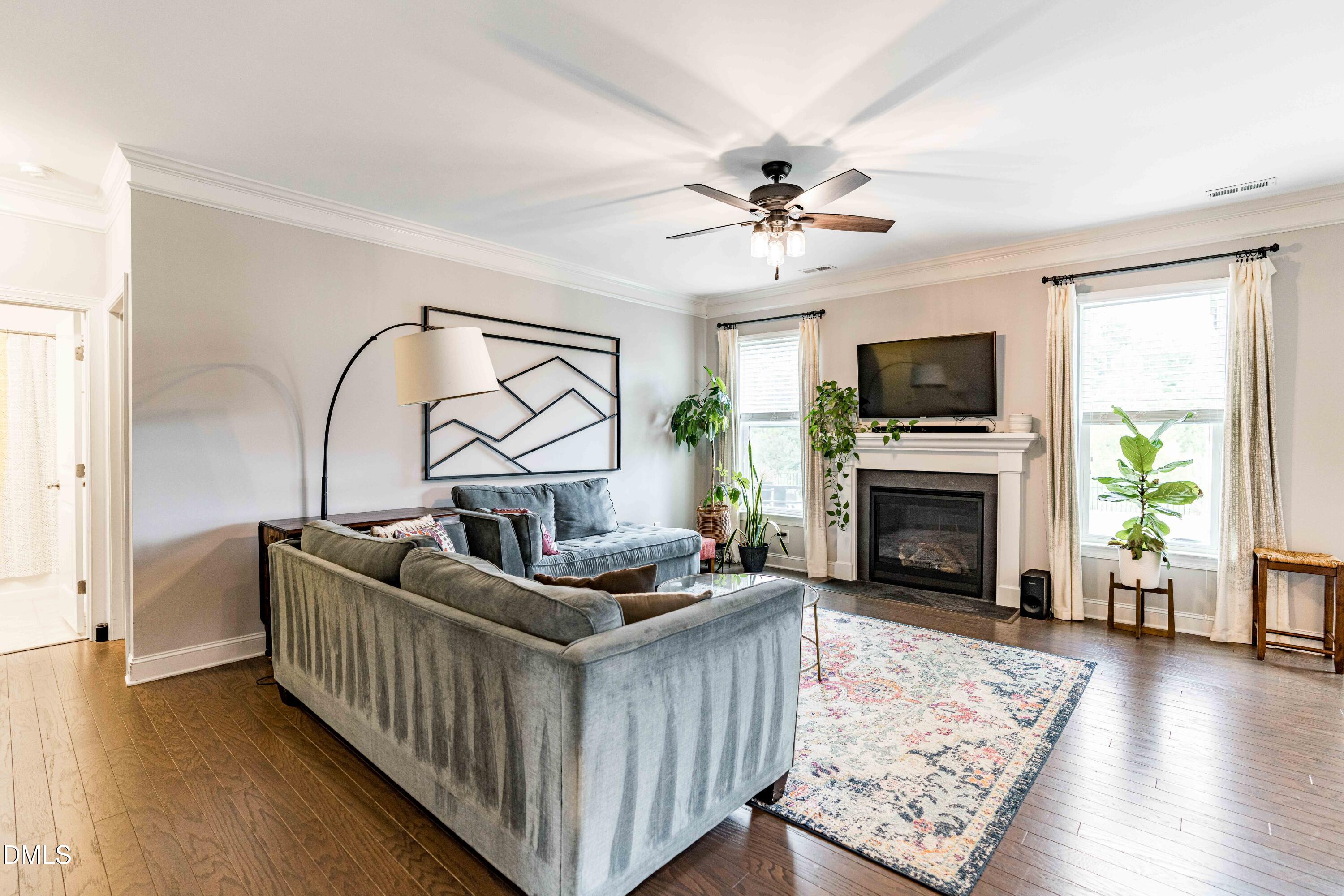 5405 Weathered Rock Court Knightdale, NC 27545 - Photo 3 of 36 a living room with furniture a fireplace and a flat screen tv