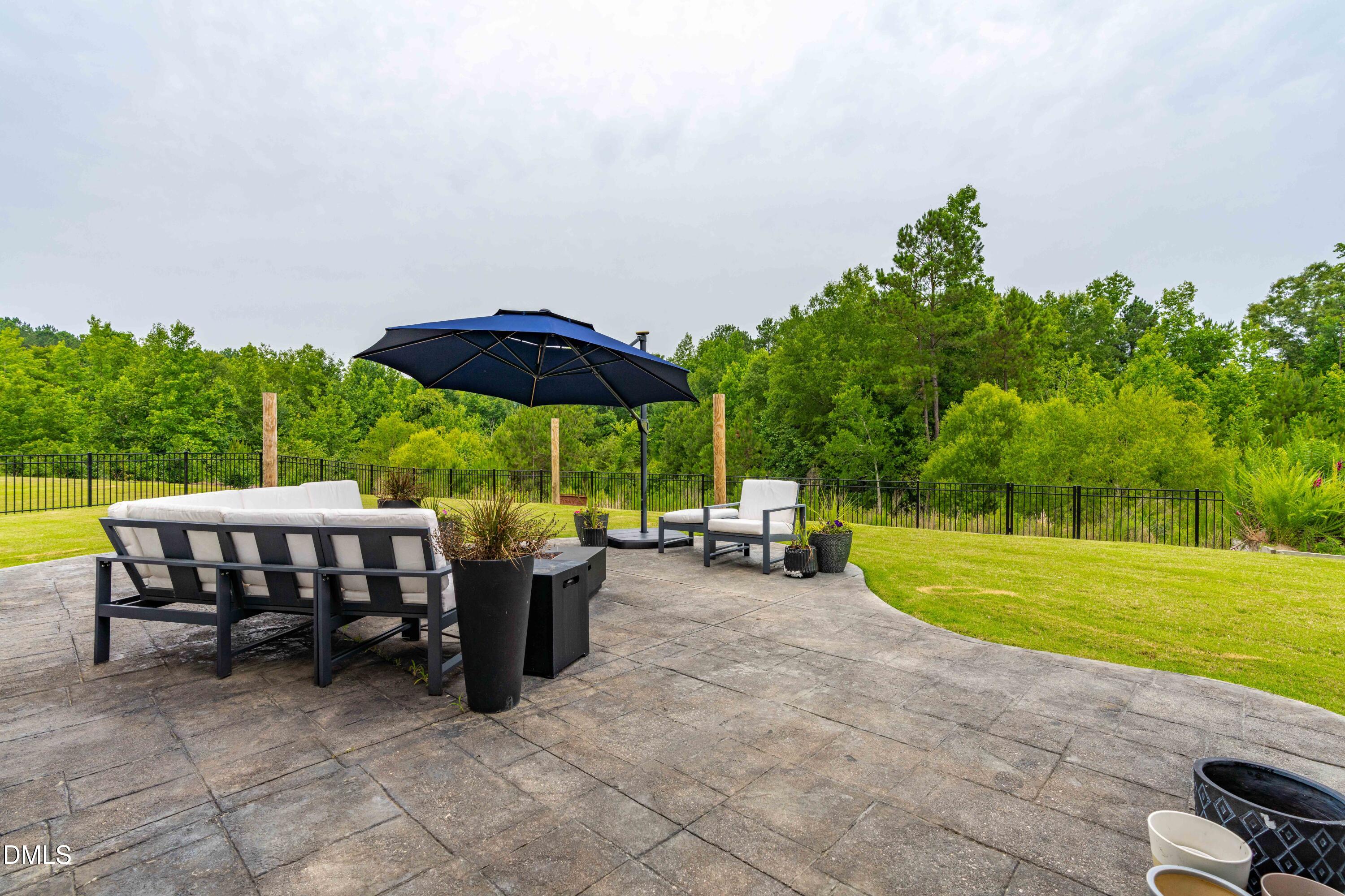 5405 Weathered Rock Court Knightdale, NC 27545 - Photo 33 of 36 a view of a swimming pool and lounge chair in the patio