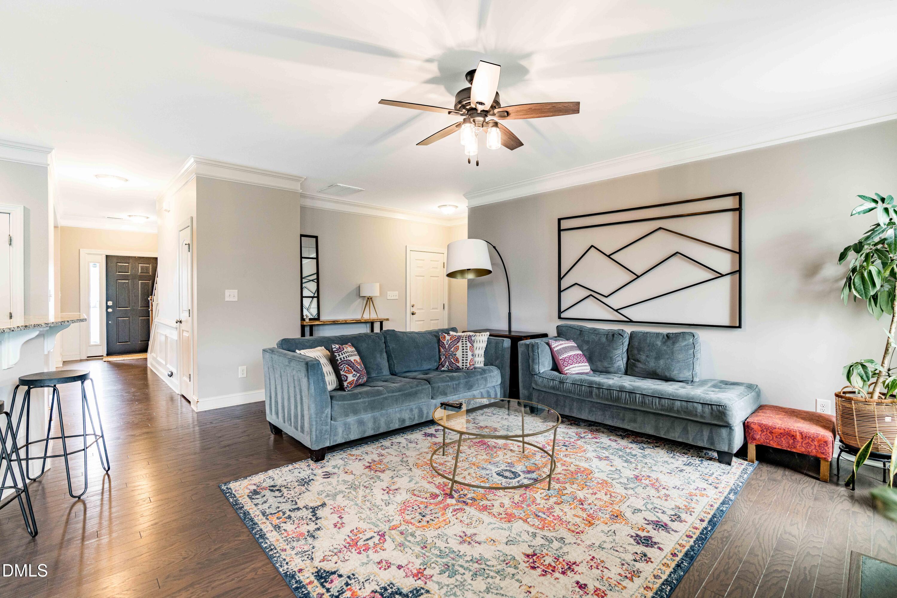 5405 Weathered Rock Court Knightdale, NC 27545 - Photo 7 of 36 a living room with furniture and a wooden floor