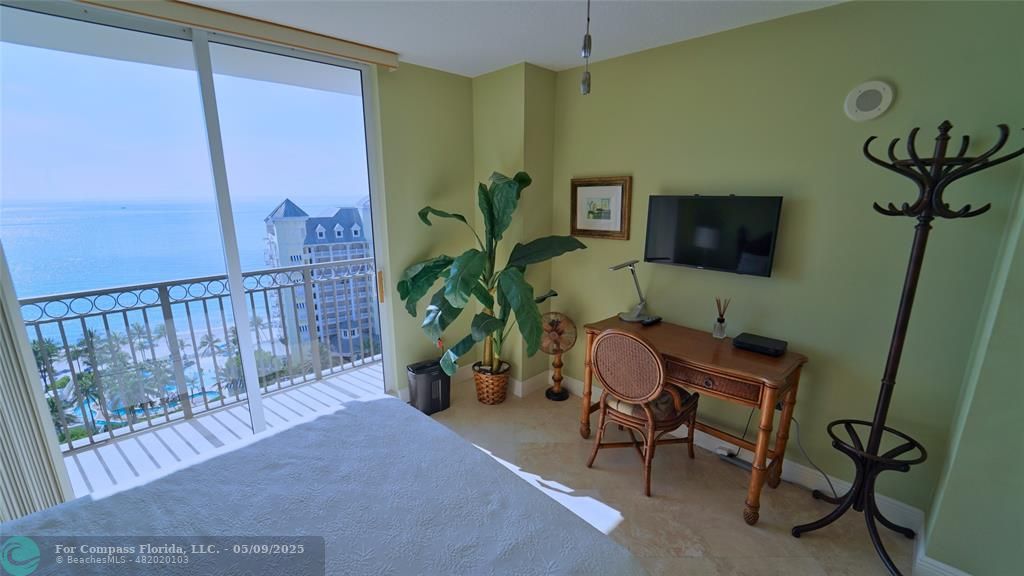 2011 North Ocean Boulevard, Unit 1606 Fort Lauderdale, FL 33305 - Photo 24 of 30 a workspace with furniture and a potted plant