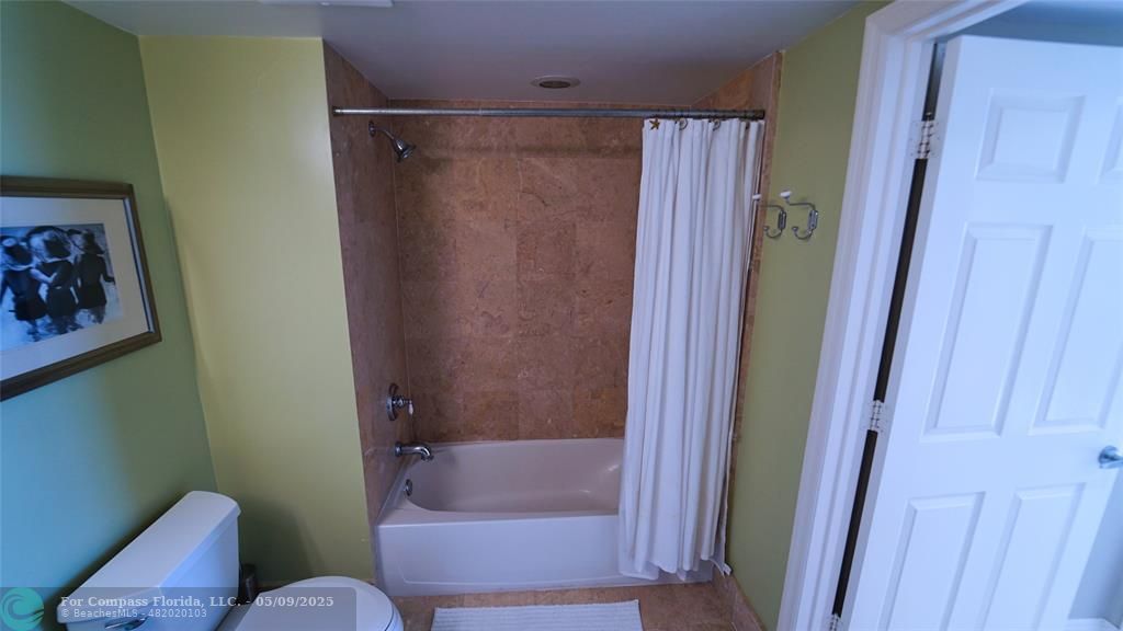 2011 North Ocean Boulevard, Unit 1606 Fort Lauderdale, FL 33305 - Photo 25 of 30 a bathroom with a shower and a toilet