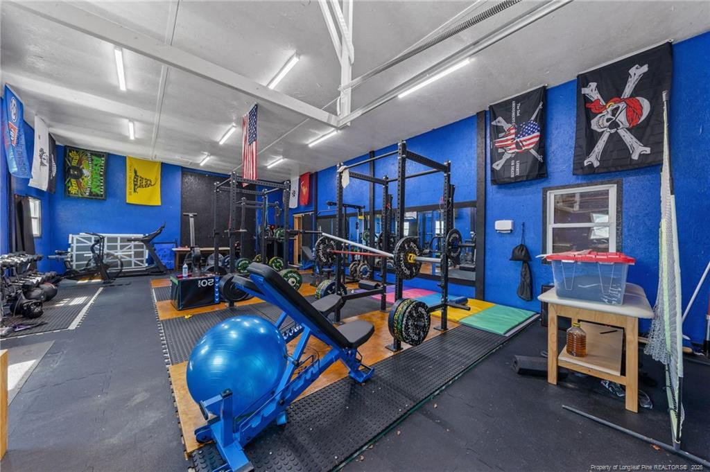 1411 Scott Currie Road Raeford, NC 28376 - Photo 24 of 25 Gym in large white barn