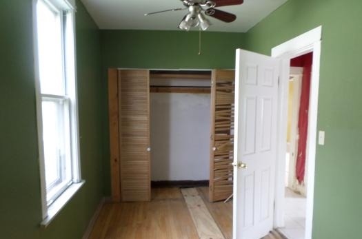 2210 North Keating Avenue Chicago, IL 60639 - Photo 7 of 10 a view of walk in closet with living room