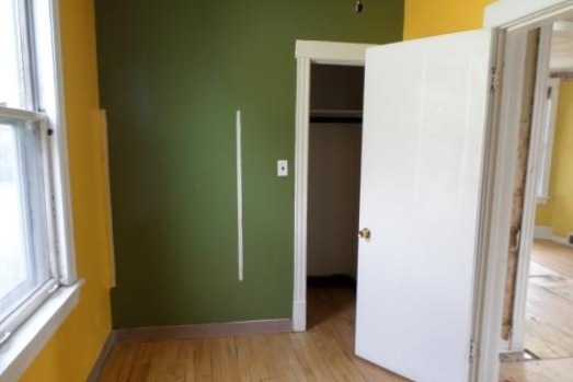 2210 North Keating Avenue Chicago, IL 60639 - Photo 8 of 10 a view of front door with wooden floor