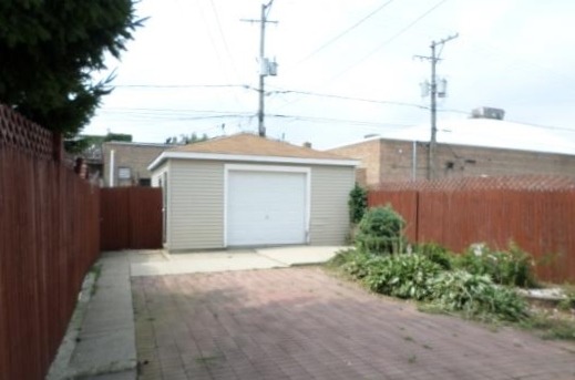 2210 North Keating Avenue Chicago, IL 60639 - Photo 10 of 10 a view of a house next to a yard