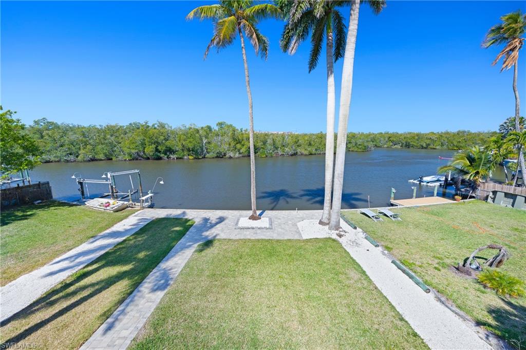 1836 Harbor Lane Naples, FL 34104 - Photo 15 of 40 a view of swimming pool with a table and chairs