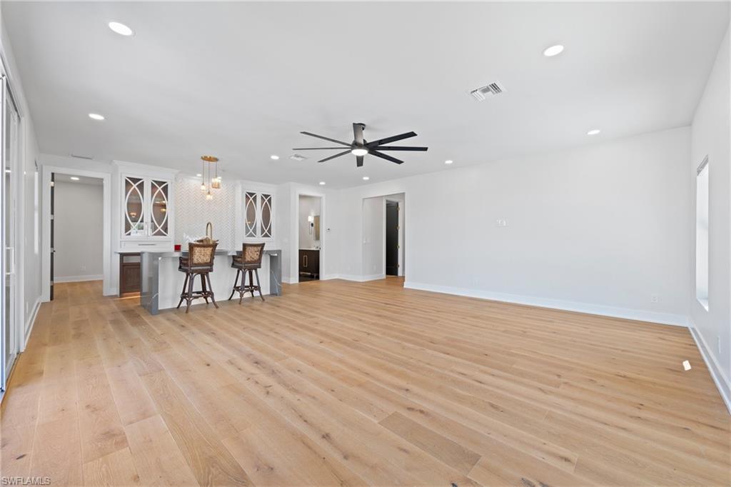 1836 Harbor Lane Naples, FL 34104 - Photo 28 of 40 a view of an empty room with a ceiling fan
