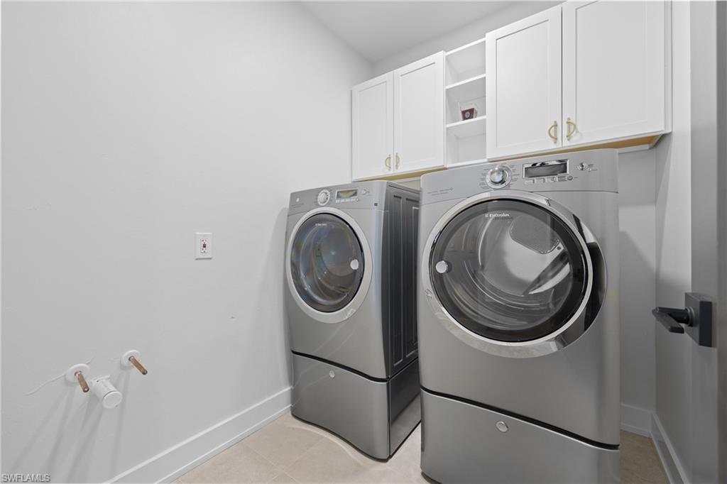 1836 Harbor Lane Naples, FL 34104 - Photo 36 of 40 a utility room with dryer and washer