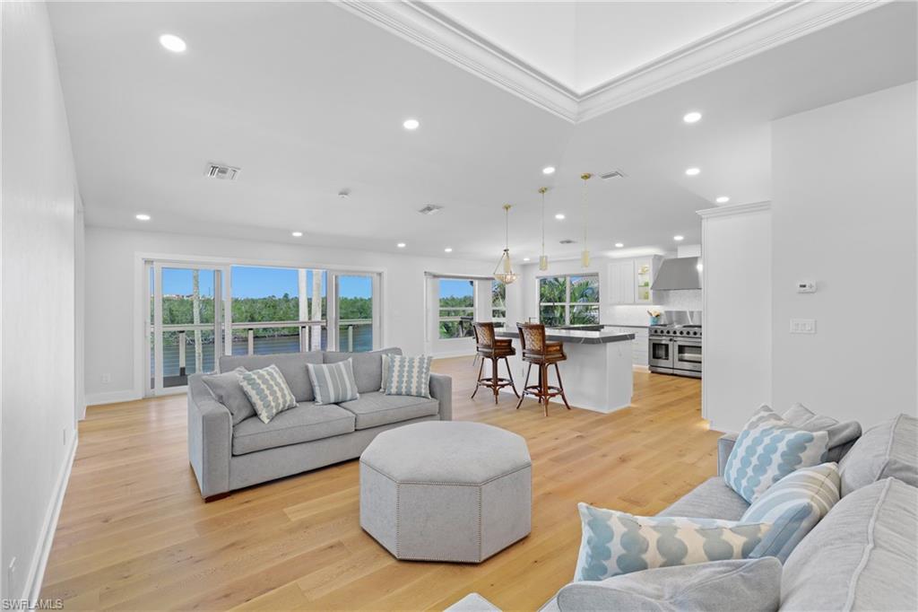 1836 Harbor Lane Naples, FL 34104 - Photo 5 of 40 a living room with furniture and a large window