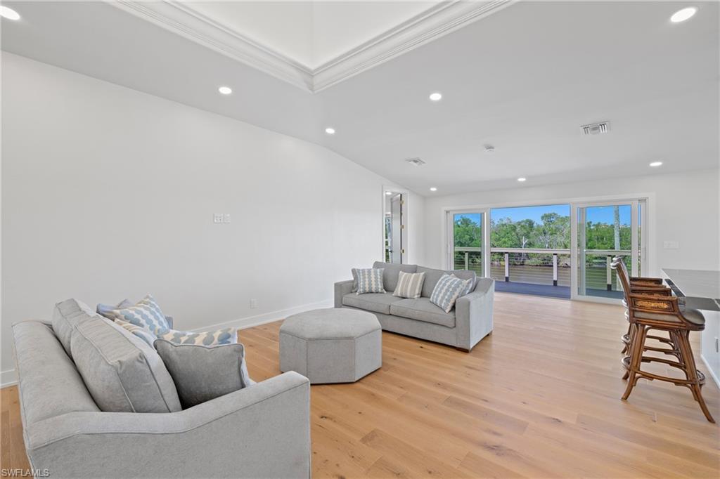1836 Harbor Lane Naples, FL 34104 - Photo 7 of 40 a living room with furniture and a large window