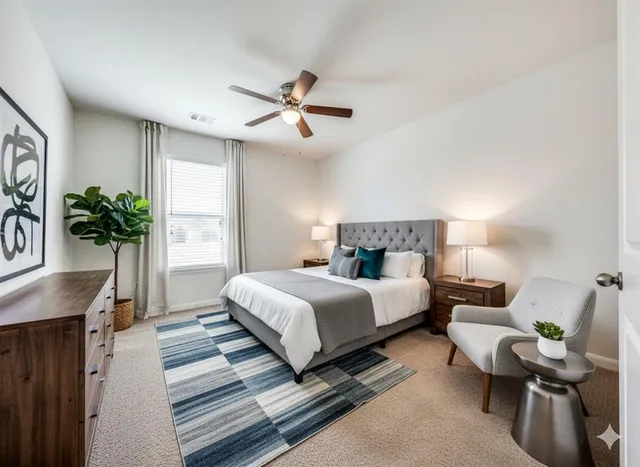 a spacious bedroom with a bed and a chandelier