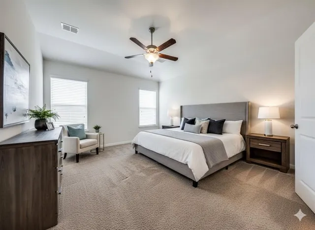 a bedroom with a bed couches and a chandelier