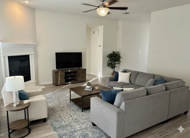 a living room with furniture and a flat screen tv