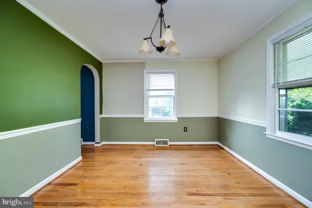 a view of a room with window and wooden floor