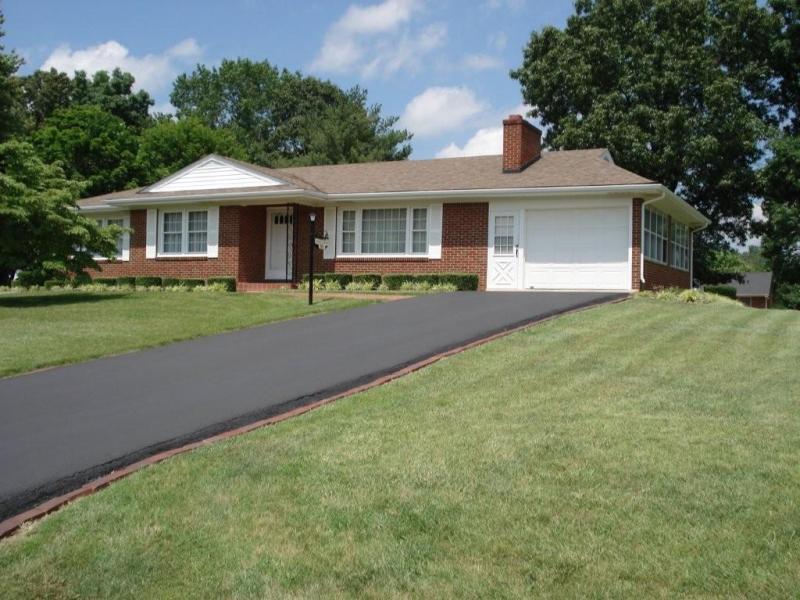 358 Blue Ridge Drive Blue Ridge, VA 24064 - Photo 2 of 22 a front view of a house with a garden and porch