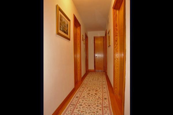 358 Blue Ridge Drive Blue Ridge, VA 24064 - Photo 11 of 22 a view of a hallway with wooden floor and a bathroom