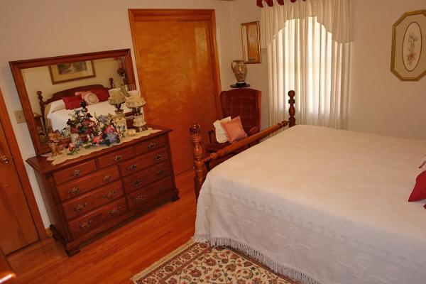 358 Blue Ridge Drive Blue Ridge, VA 24064 - Photo 12 of 22 a bedroom with a bed and a window