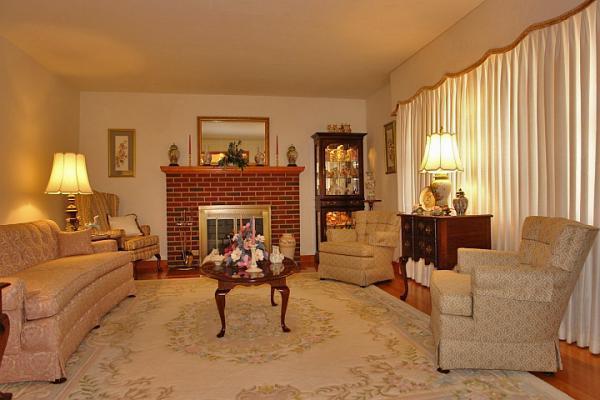 358 Blue Ridge Drive Blue Ridge, VA 24064 - Photo 6 of 22 a living room with furniture a fireplace and a large window