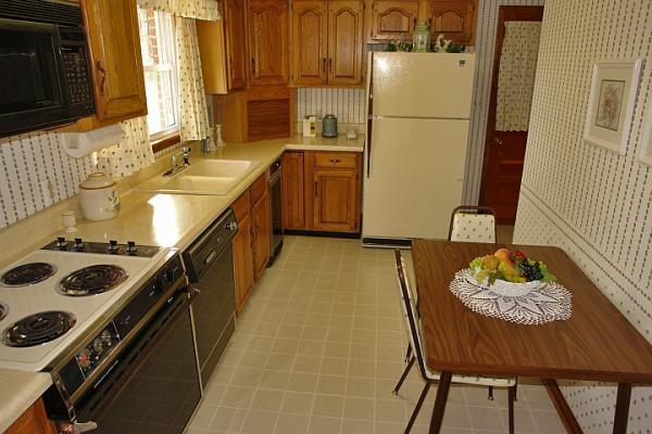 358 Blue Ridge Drive Blue Ridge, VA 24064 - Photo 9 of 22 a kitchen with stainless steel appliances granite countertop a sink stove and refrigerator