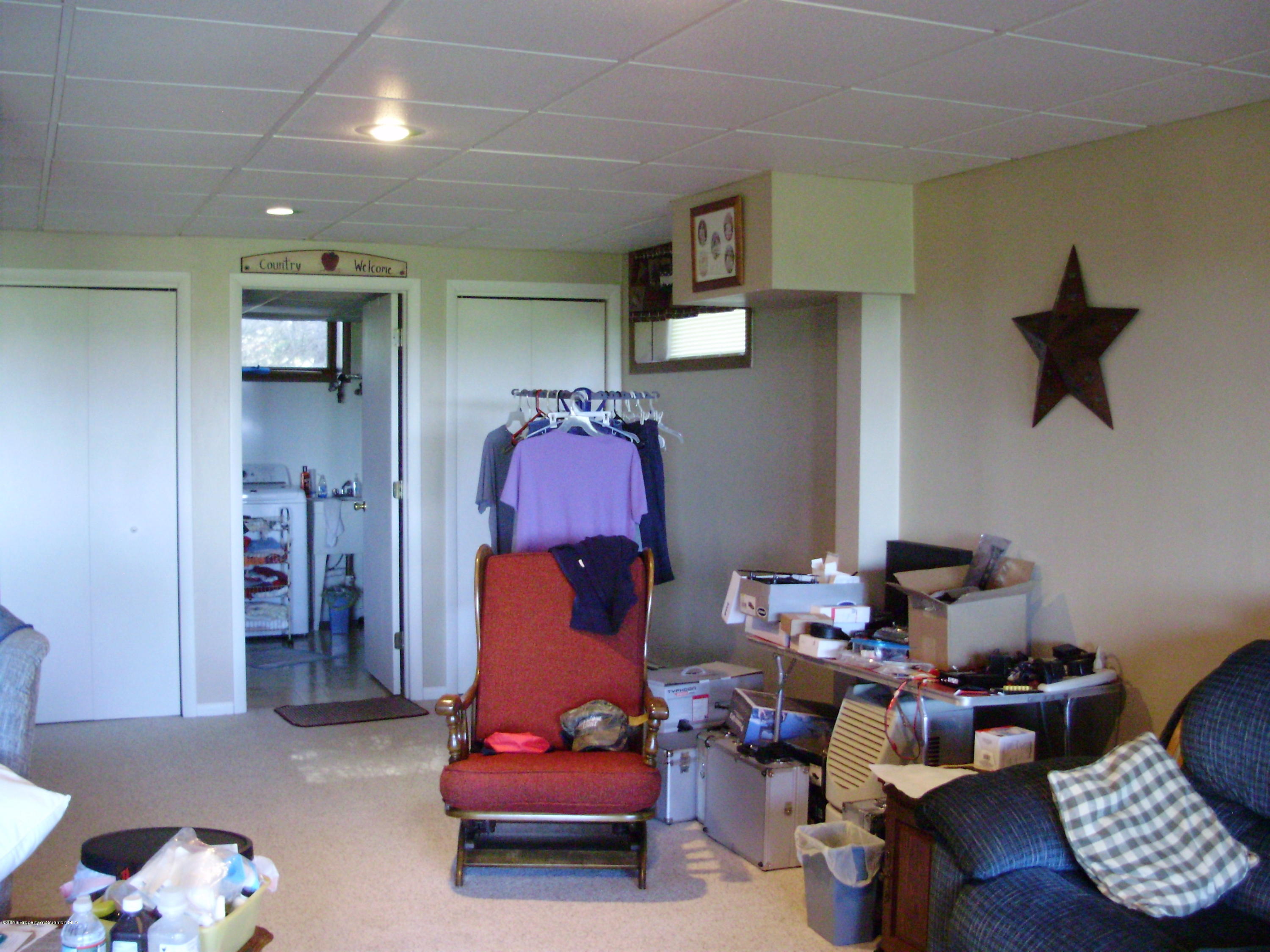906 Johnson Road Hallstead, PA 18822 - Photo 16 of 31 a room with furniture toys and a chandelier