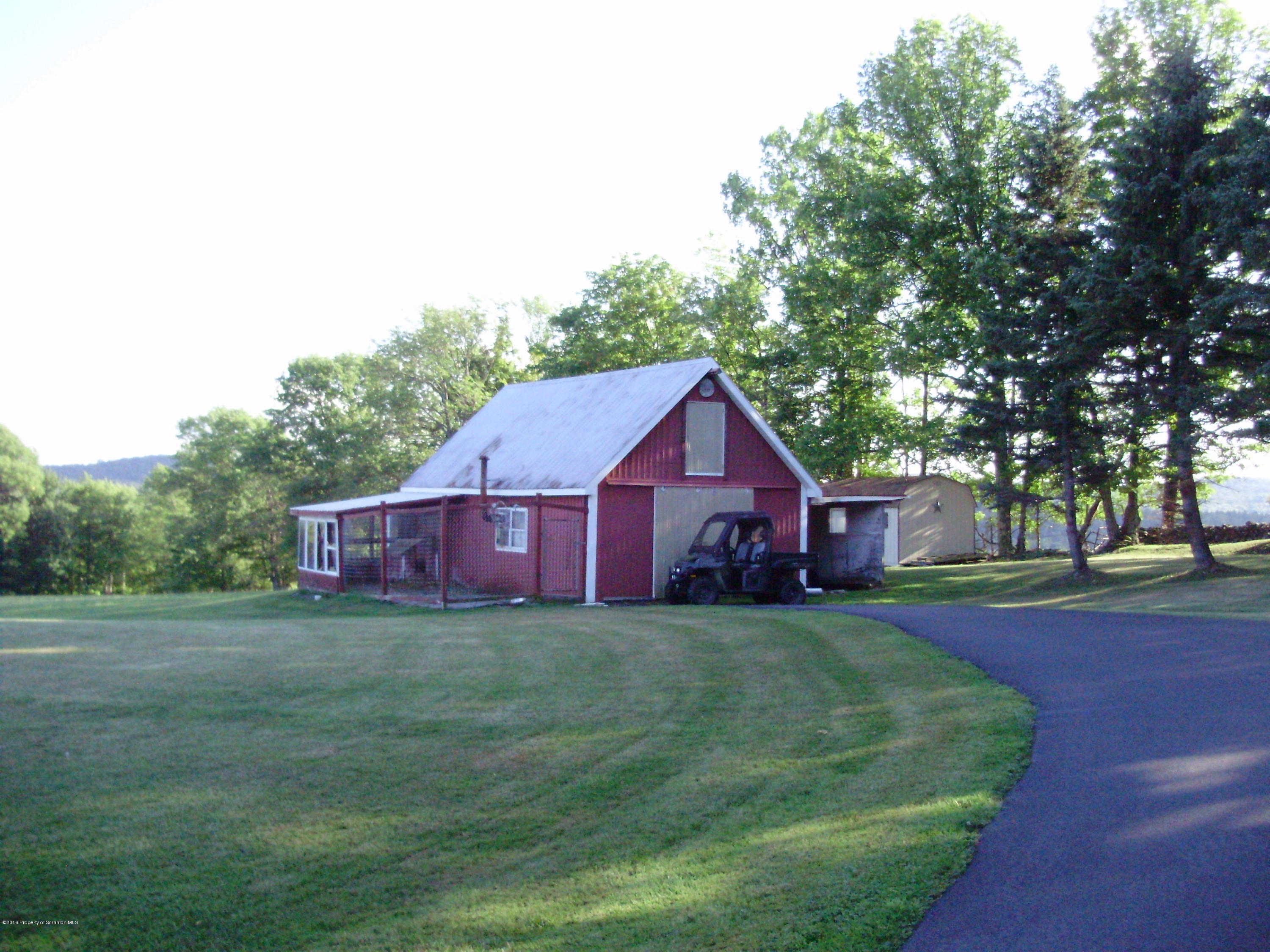 906 Johnson Road Hallstead, PA 18822 - Photo 23 of 31 a view of a big house with a big yard and large trees