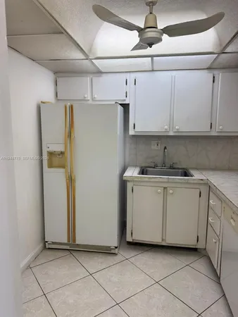 a utility room with cabinets