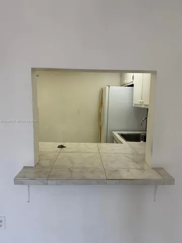 a bathroom with a sink and mirror