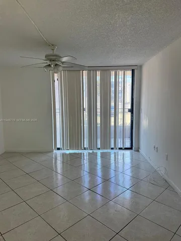 an empty room with glass door and glass door