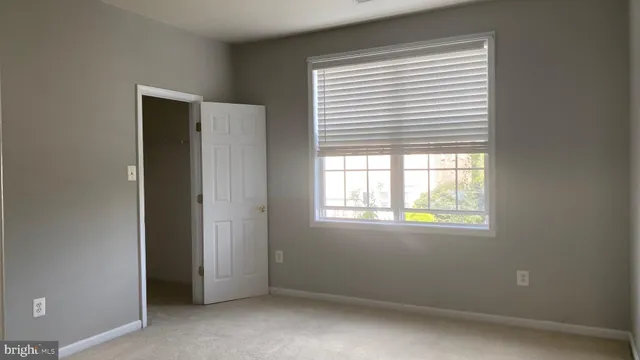 a kitchen with granite countertop a sink a stove and cabinets