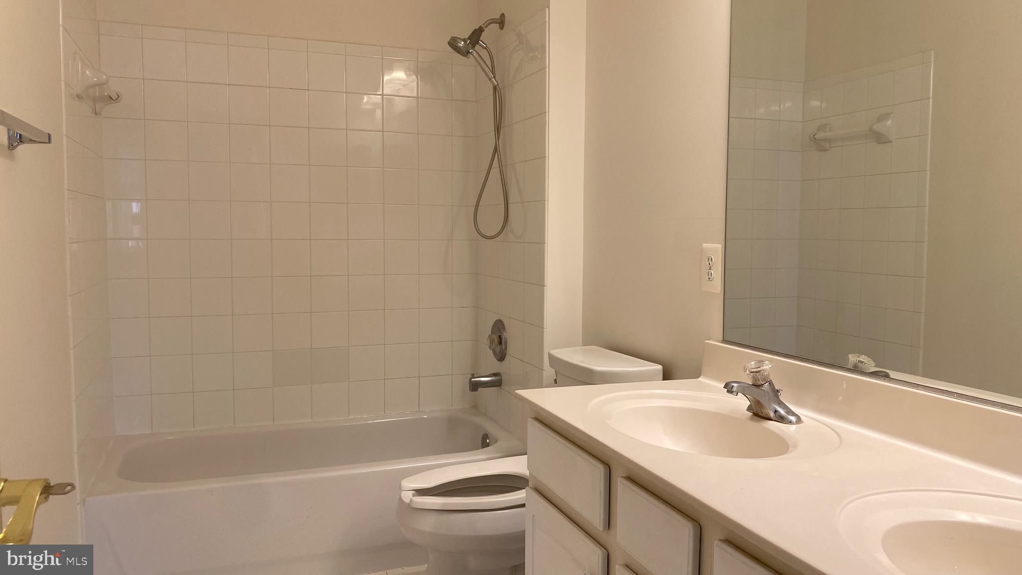 3948 Addison Woods Road Frederick, MD 21704 - Photo 17 of 19 a bathroom with a sink toilet and shower