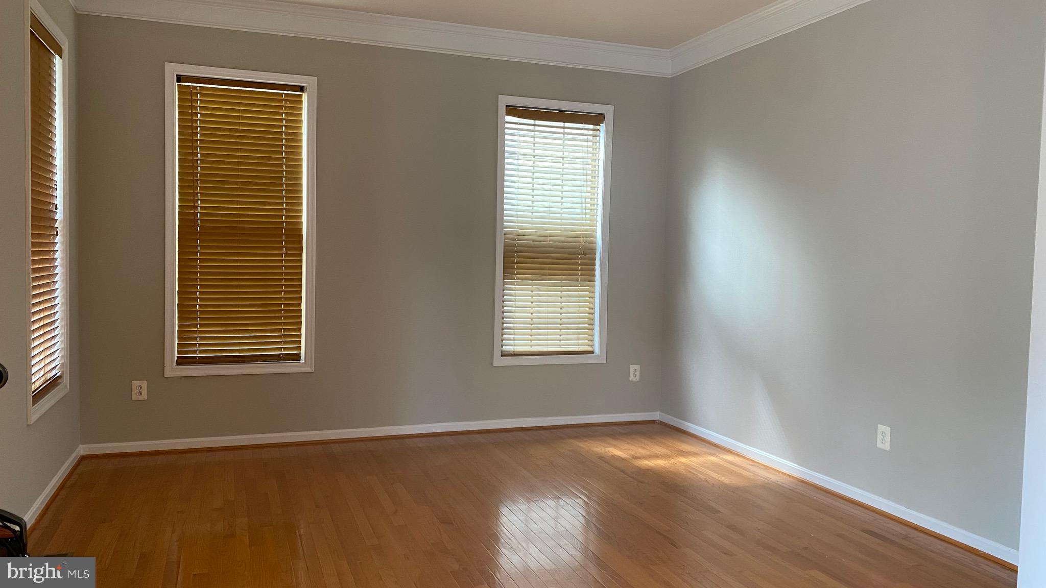 3948 Addison Woods Road Frederick, MD 21704 - Photo 8 of 19 a view of an empty room with wooden floor and a window