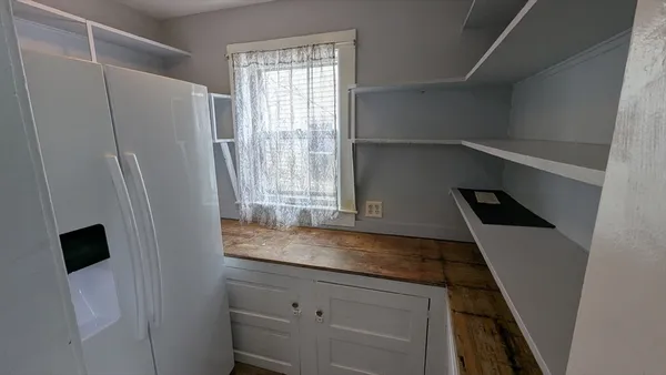 a kitchen with a refrigerator and a sink