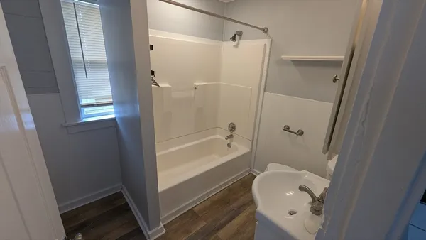 a bathroom with a shower and toilet