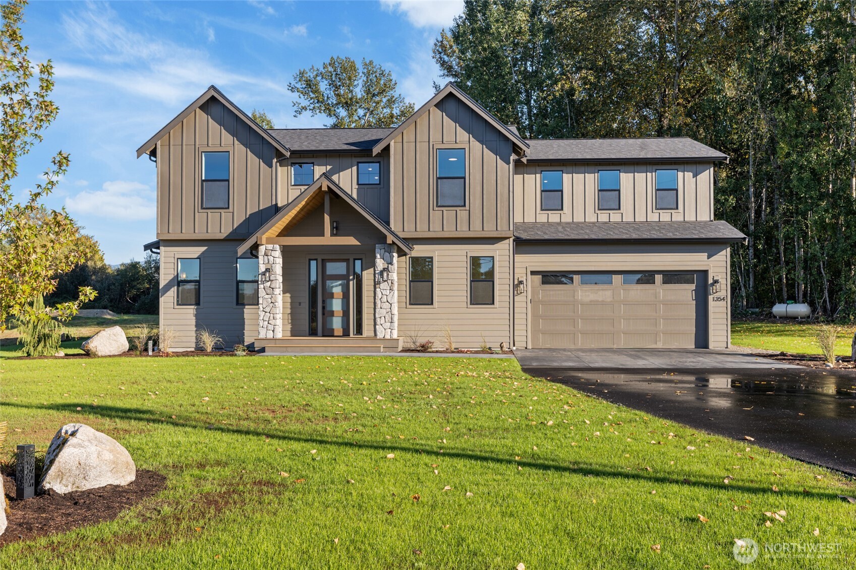 1354 Huntley Road Bellingham, WA 98226 - Photo 1 of 40 a front view of a house with a yard