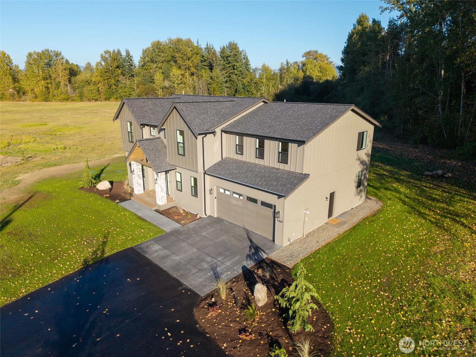 1354 Huntley Road Bellingham, WA 98226 - Photo 37 of 40 an aerial view of a house with a yard basket ball court and outdoor seating