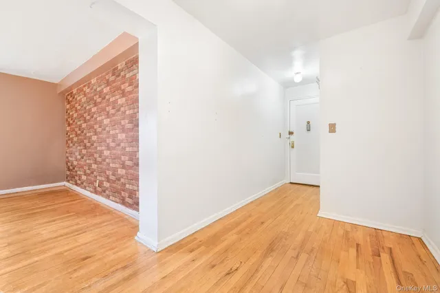 a view of hallway with wooden floor
